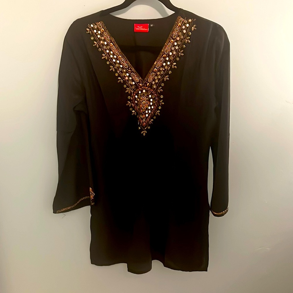 Beautiful beaded tunic top. Never worn.